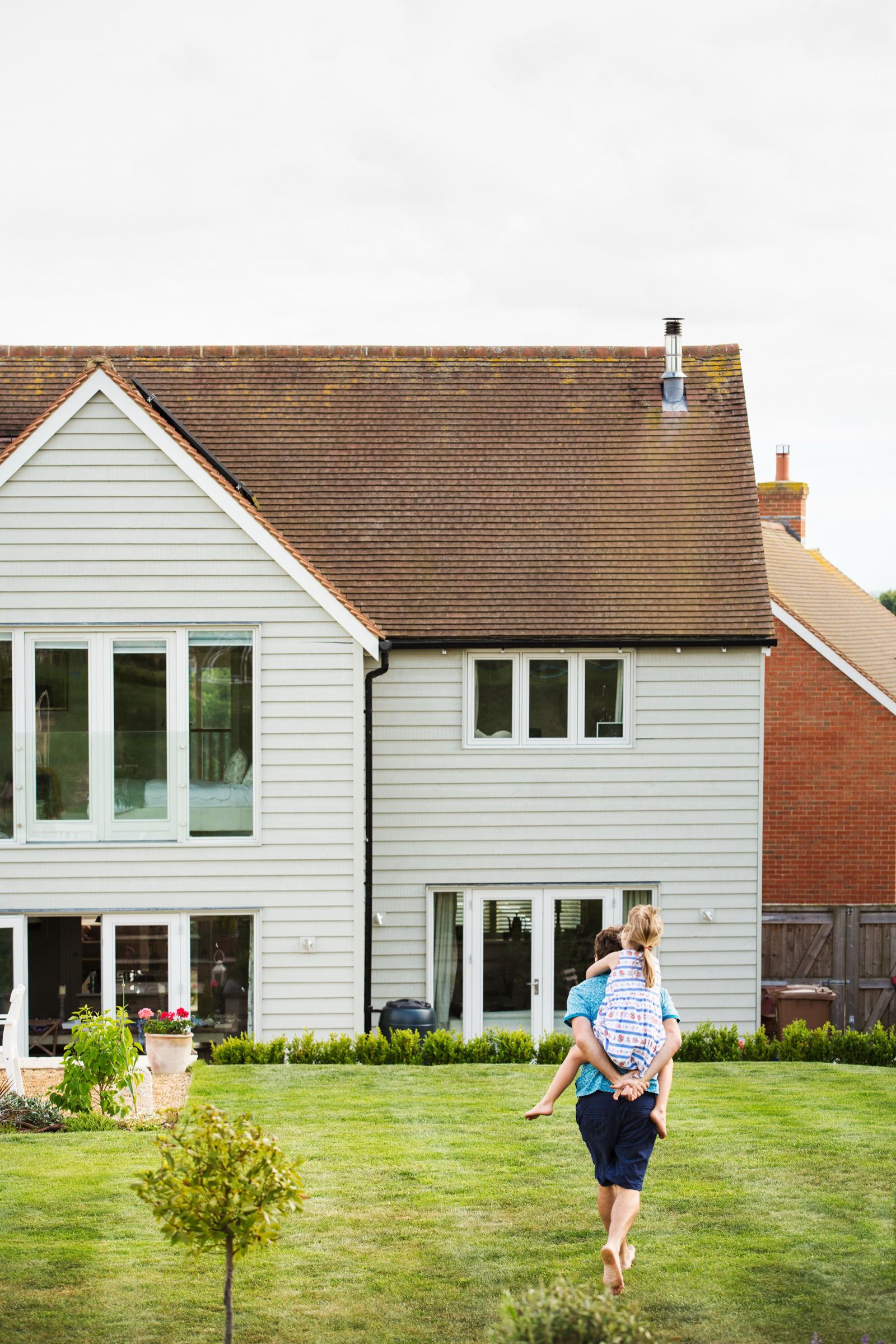 Family walking toward their new home